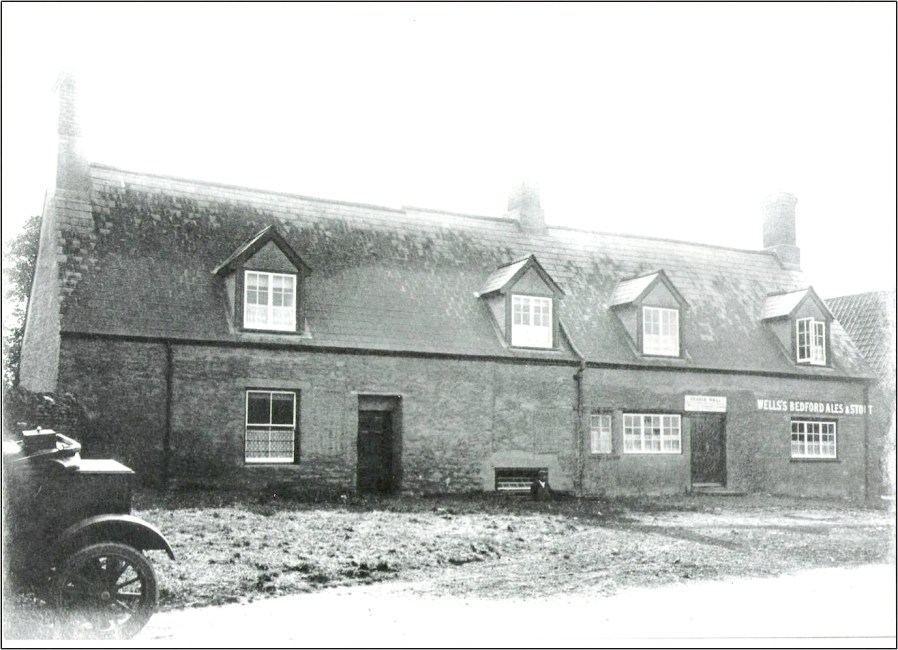 The Horseshoe, Lavendon, with George Hall peering out of the cellar, circa 1920s